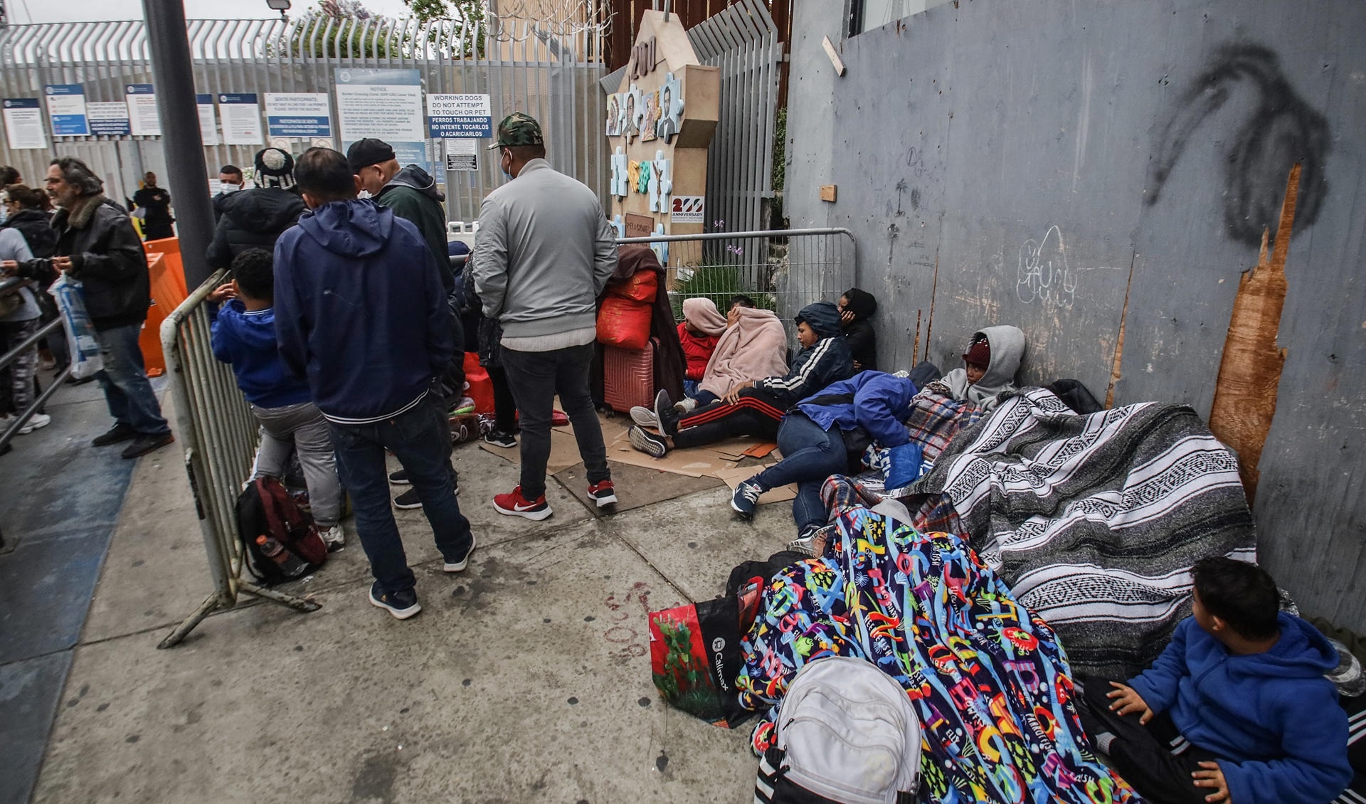 Migrants seeking asylum in the US camp at the border crossing in Tijuana
