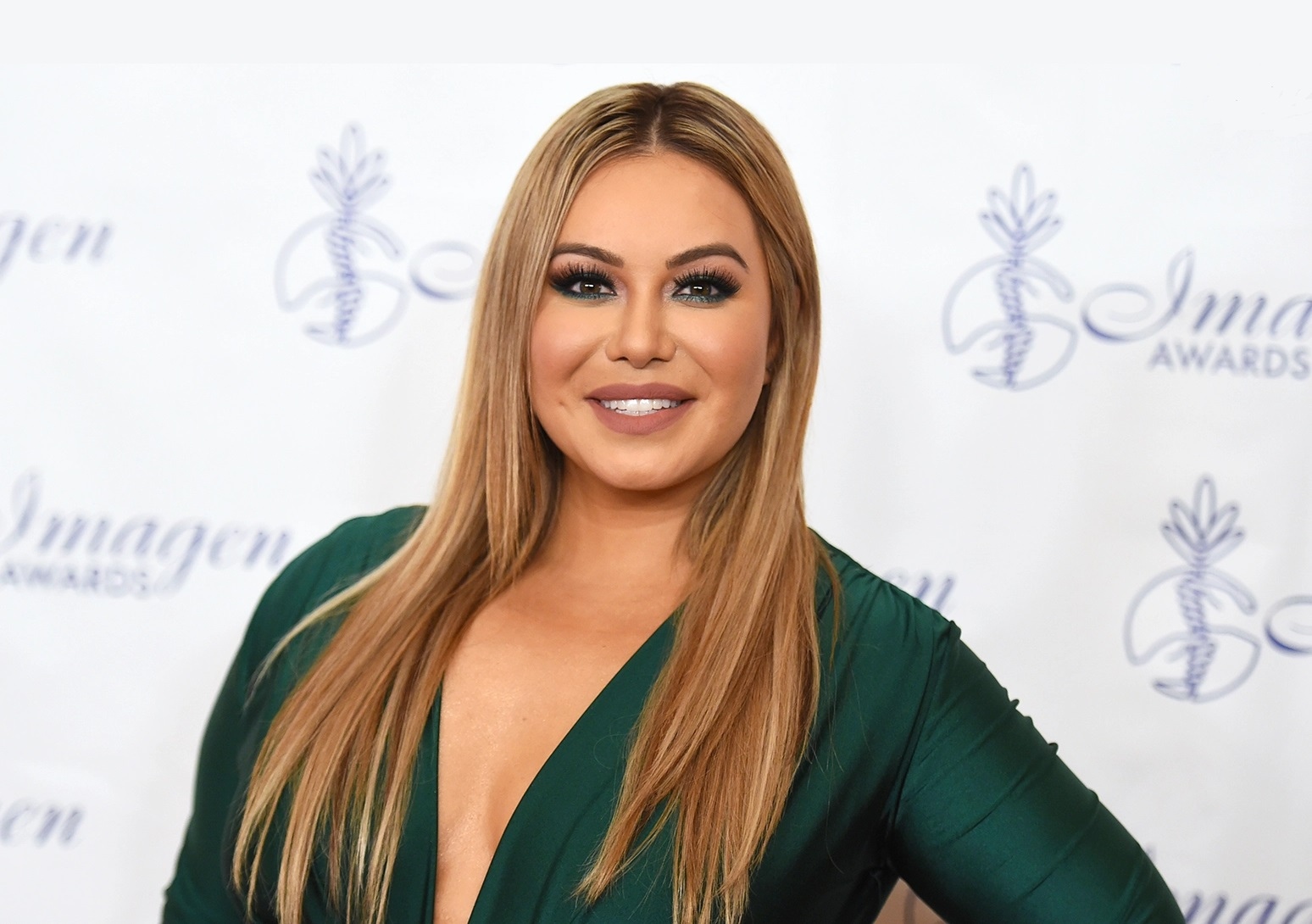 Chiquis Rivera wiggled in a gold dress and then went to Disney