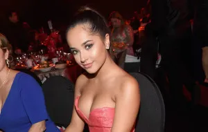 Becky G shows off her figure by wearing a tight jumpsuit with openings